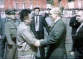 N. Korea's Kim shakes hands with Putin at Pyongyang airport